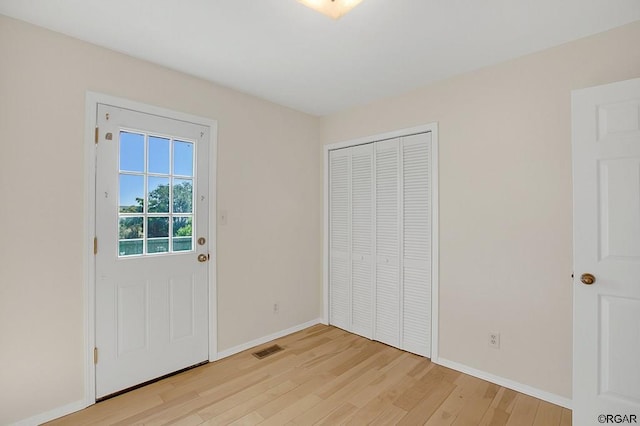 doorway with light hardwood / wood-style flooring