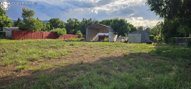 1540 Lombard St, Canon City, CO 81212 - view of yard with a carport and a storage unit