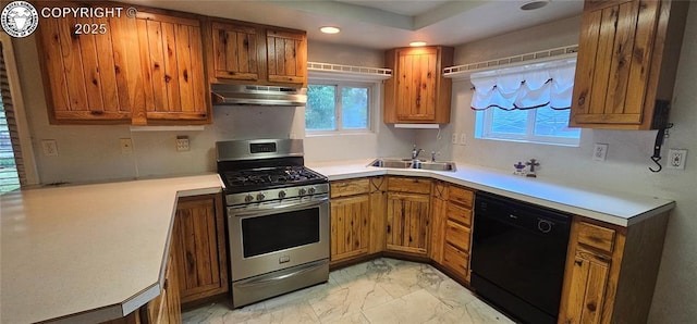 1540 Lombard St, Canon City, CO 81212 - kitchen with black dishwasher, stainless steel range with gas stovetop, under cabinet range hood, light marble finish flooring, and brown cabinets