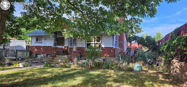 1540 Lombard St, Canon City, CO 81212 - bungalow with brick siding and stucco siding