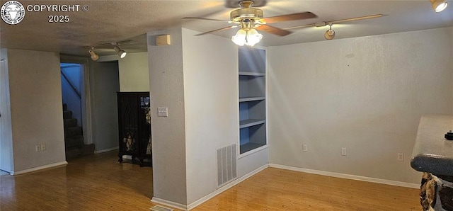 1540 Lombard St, Canon City, CO 81212 - interior space featuring rail lighting, wood finished floors, and stairs