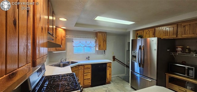 1540 Lombard St, Canon City, CO 81212 - kitchen with stainless steel appliances, brown cabinetry, light countertops, ventilation hood, and light marble finish flooring