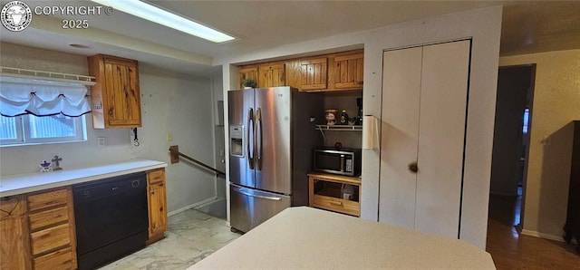 1540 Lombard St, Canon City, CO 81212 - kitchen featuring stainless steel appliances, brown cabinets, and light countertops