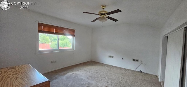 1540 Lombard St, Canon City, CO 81212 - unfurnished bedroom featuring carpet floors, vaulted ceiling, a ceiling fan, and a closet