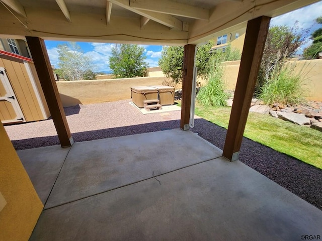 view of patio / terrace with a hot tub