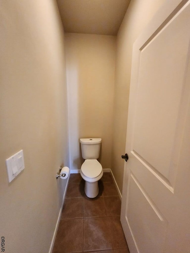 bathroom featuring tile patterned floors and toilet