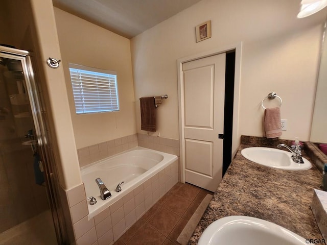 bathroom featuring tile patterned floors, vanity, and independent shower and bath