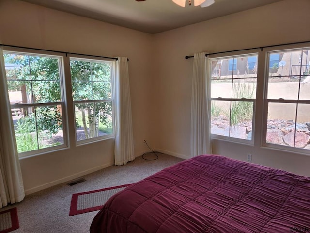 unfurnished bedroom featuring ceiling fan and carpet