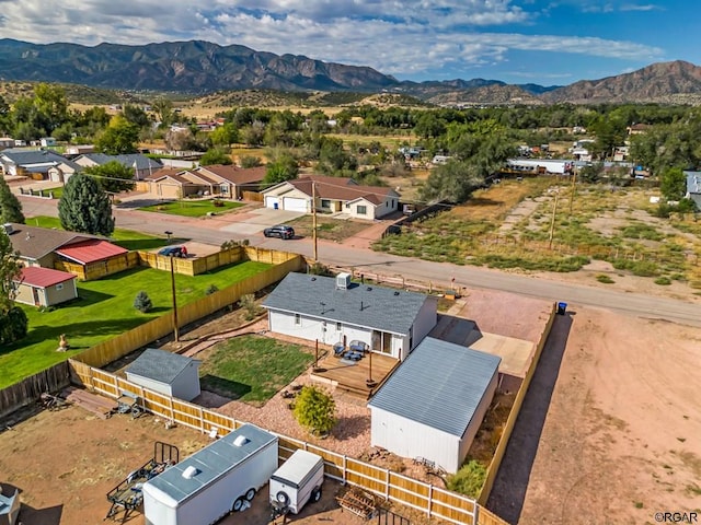 birds eye view of property featuring a mountain view