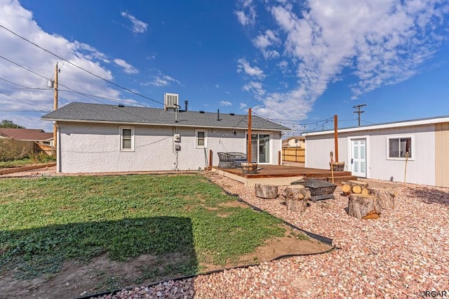 back of property featuring a lawn, a patio, and a deck