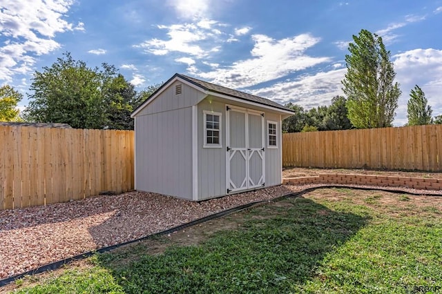 view of outbuilding with a lawn