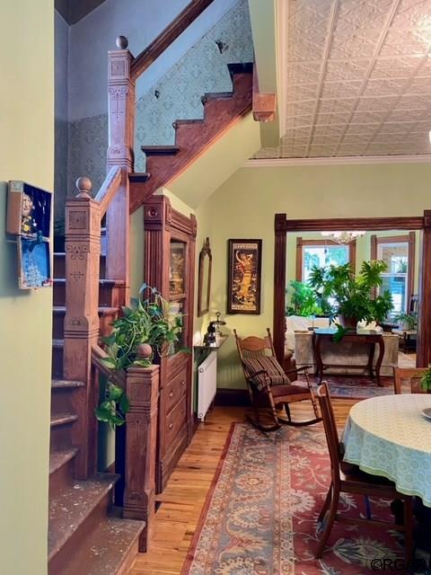 interior space featuring crown molding and light wood-type flooring