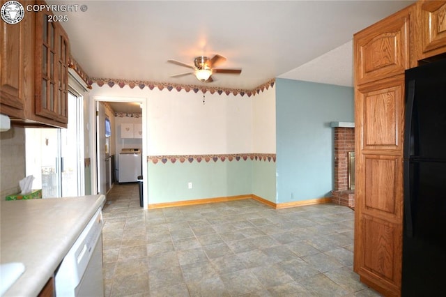 kitchen with white dishwasher, ceiling fan, light countertops, freestanding refrigerator, and baseboards