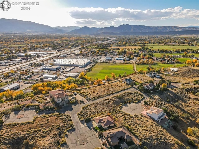 birds eye view of property with a mountain view