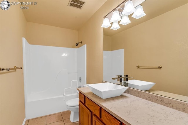 full bathroom with shower / bath combination, vanity, tile patterned floors, and toilet