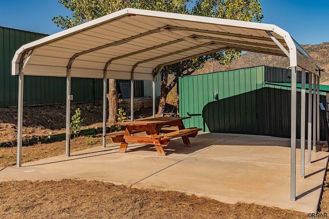 view of parking / parking lot with a carport