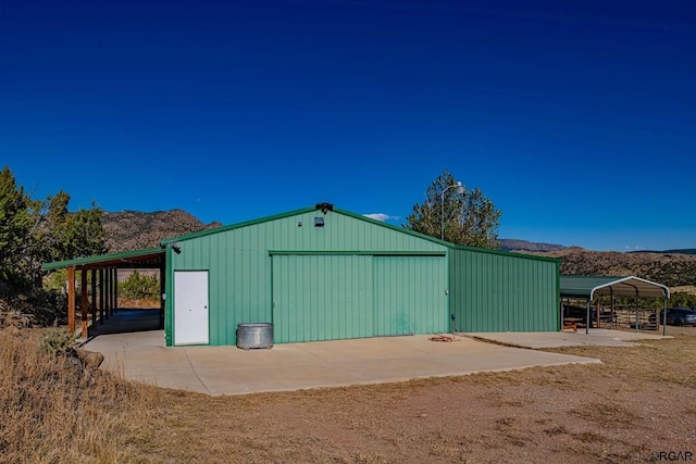 view of outbuilding featuring a mountain view