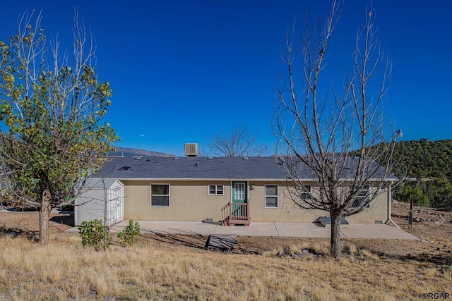 back of house featuring a patio area