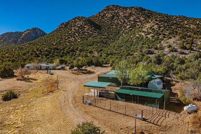 mountain view featuring a rural view