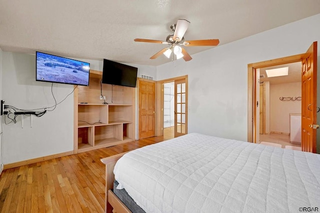 bedroom featuring hardwood / wood-style floors and ceiling fan