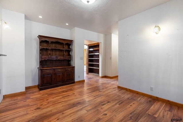 unfurnished living room with light hardwood / wood-style flooring