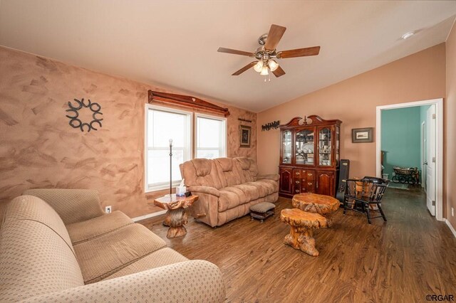 living room with dark hardwood / wood-style flooring, vaulted ceiling, and ceiling fan