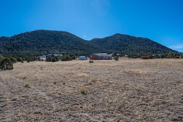 property view of mountains featuring a rural view