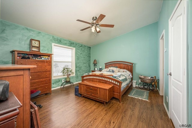 bedroom with dark wood-type flooring and ceiling fan