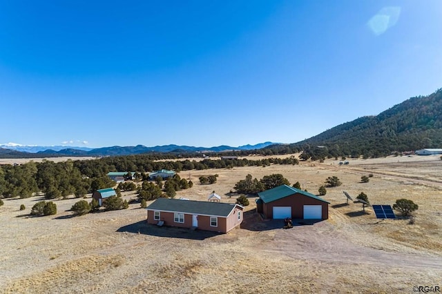 bird's eye view with a mountain view and a rural view