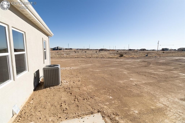 view of yard with central AC