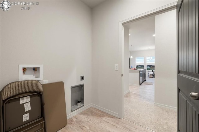 laundry room with hookup for an electric dryer, washer hookup, and light carpet