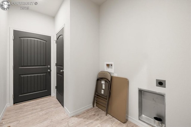 laundry area with electric dryer hookup, washer hookup, and light wood-type flooring