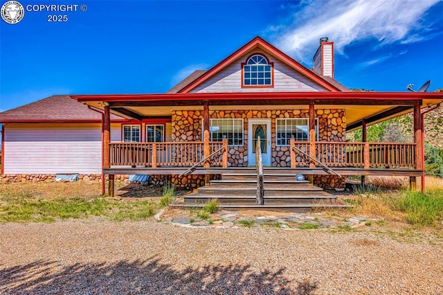 161 Shannon Rd, Cotopaxi, CO 81223 - view of front of property featuring a chimney, covered porch, and stone siding