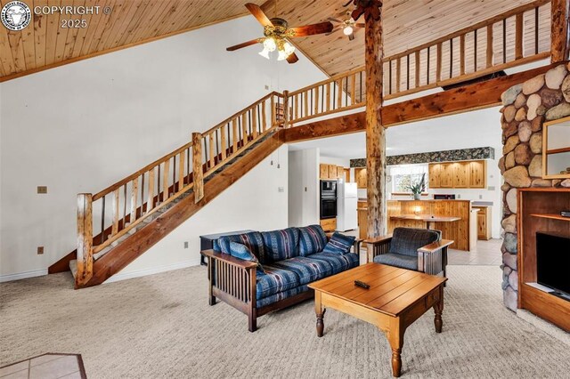161 Shannon Rd, Cotopaxi, CO 81223 - living area featuring stairs, high vaulted ceiling, wooden ceiling, ceiling fan, and light carpet