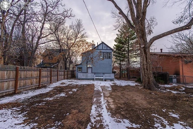 121 W Evans Ave, Pueblo, CO 81004 - yard layered in snow with fence and a wooden deck