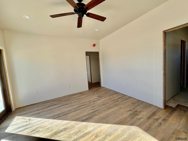 empty room featuring ceiling fan and light wood-type flooring