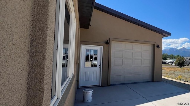 garage featuring a mountain view