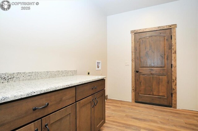202 Fox Run, Westcliffe, CO 81252 - clothes washing area with laundry area, light wood-style floors, hookup for a washing machine, and hookup for an electric dryer