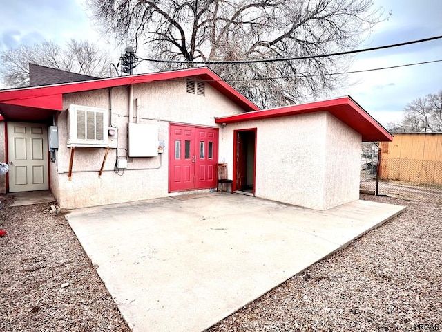 back of property with a patio area