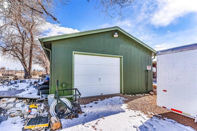 view of snow covered garage