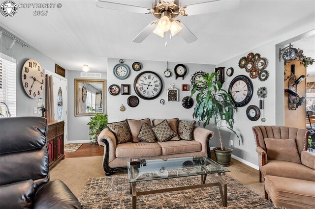 living room with light colored carpet and ceiling fan