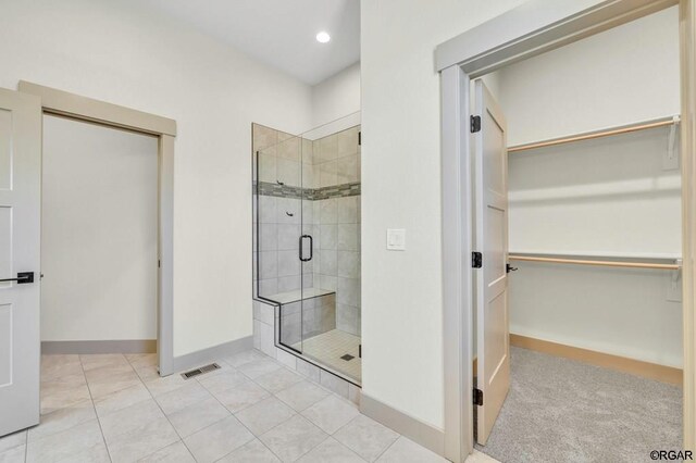 117 Rocchio Dr, Florence, CO 81226 - full bath featuring a walk in closet, baseboards, a shower stall, and recessed lighting