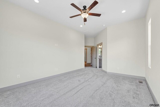 carpeted empty room with ceiling fan