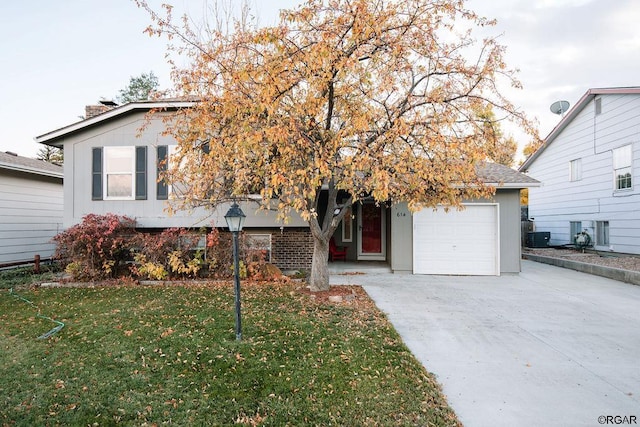 view of front of home with a garage and a front yard