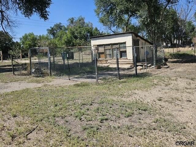 760 D St, Penrose, CO 81240 - view of outbuilding with an outbuilding and fence