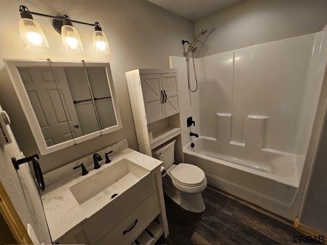 760 D St, Penrose, CO 81240 - full bath with vanity, toilet, wood finished floors, and shower / washtub combination