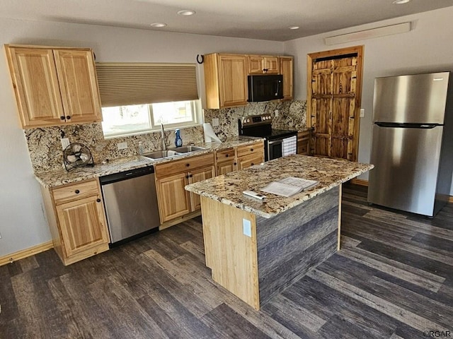 760 D St, Penrose, CO 81240 - kitchen featuring dark wood-style floors, backsplash, appliances with stainless steel finishes, and a sink