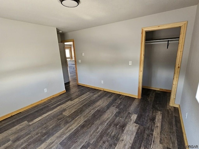760 D St, Penrose, CO 81240 - unfurnished bedroom with a closet, baseboards, and wood finished floors