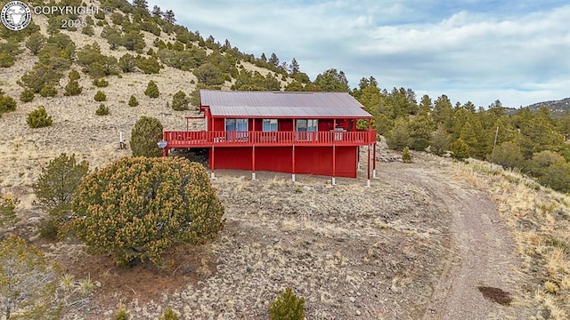 297 S Matterhorn Cir, Westcliffe, CO 81252 - rear view of house featuring metal roof and a wooden deck