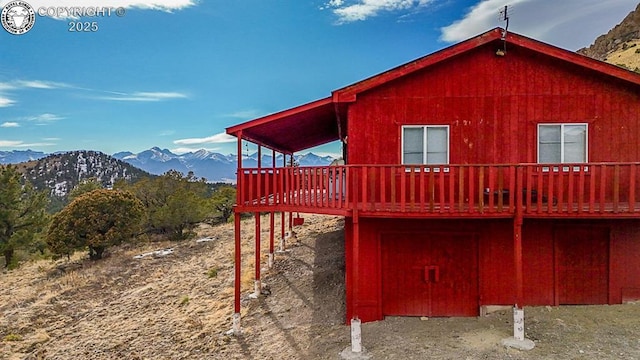 297 S Matterhorn Cir, Westcliffe, CO 81252 - view of home's exterior with a deck with mountain view
